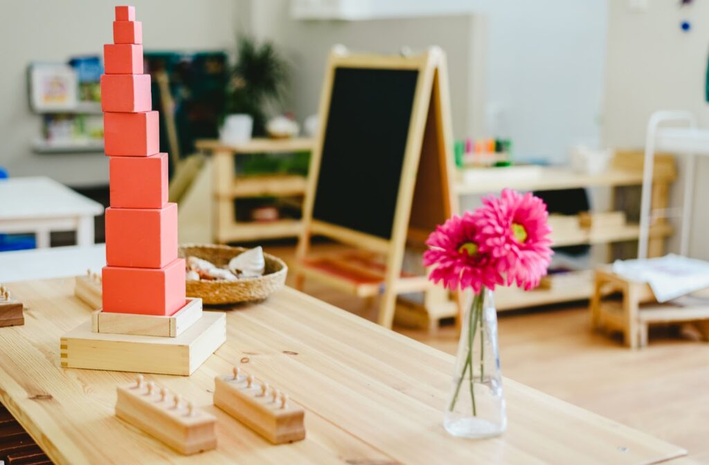 montessori classroom with building blocks and flowers