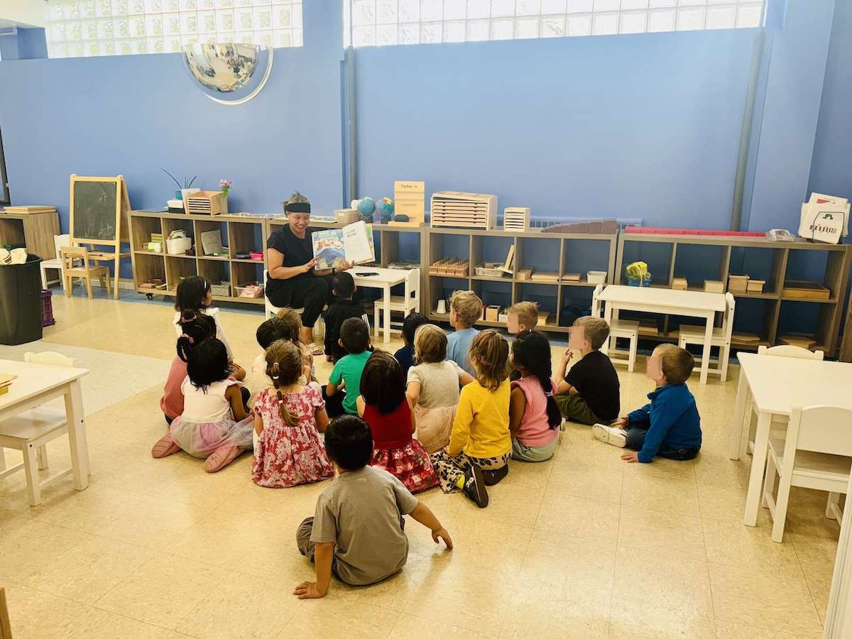 Children at Mosaic Montessori in Calgary sitting for circle time.